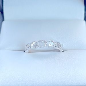 18kwg .52 ct organic rose cut
diamonds in milgrain bezels band.